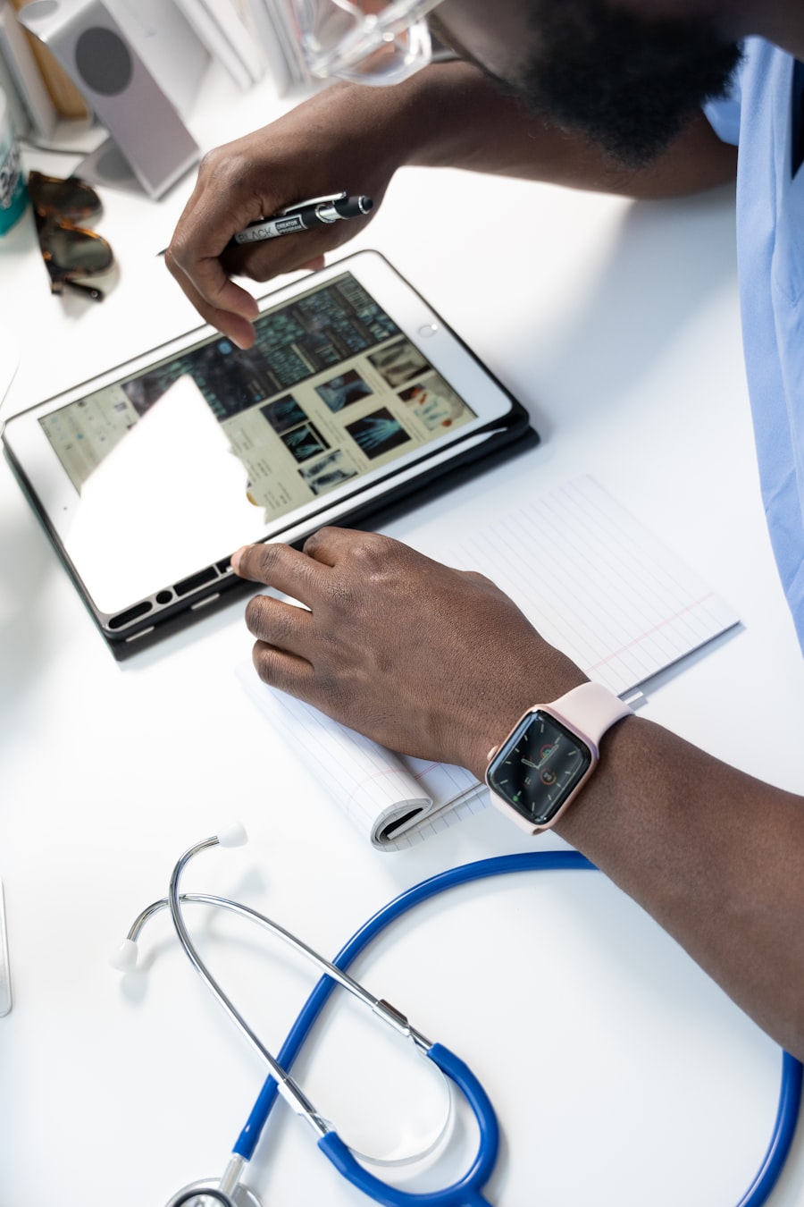 Clinician capturing patient records on a tablet